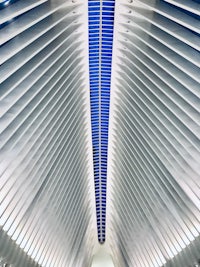 the ceiling of a subway tunnel with a blue sky